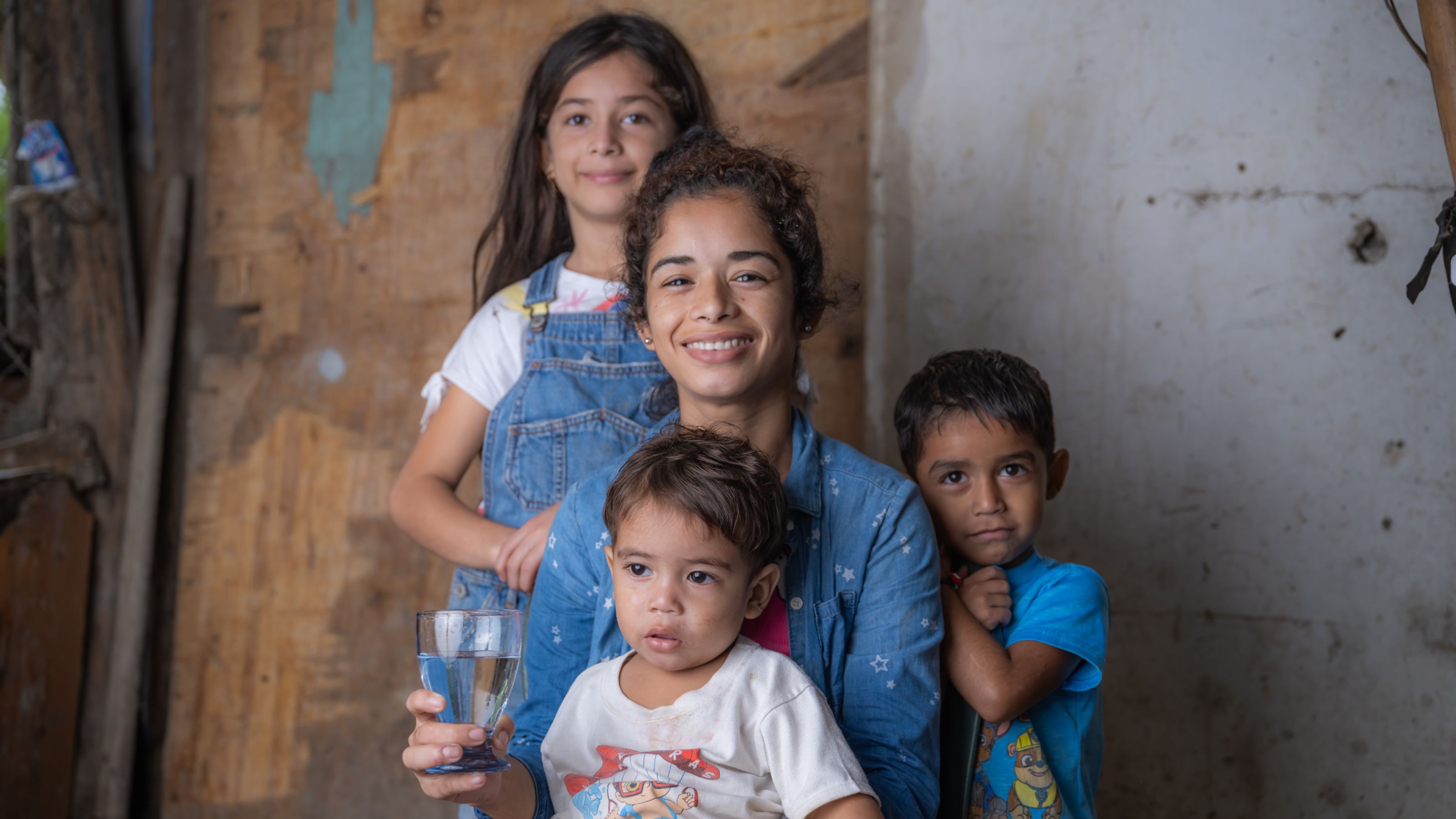 Mother and children drinking safe, clean water